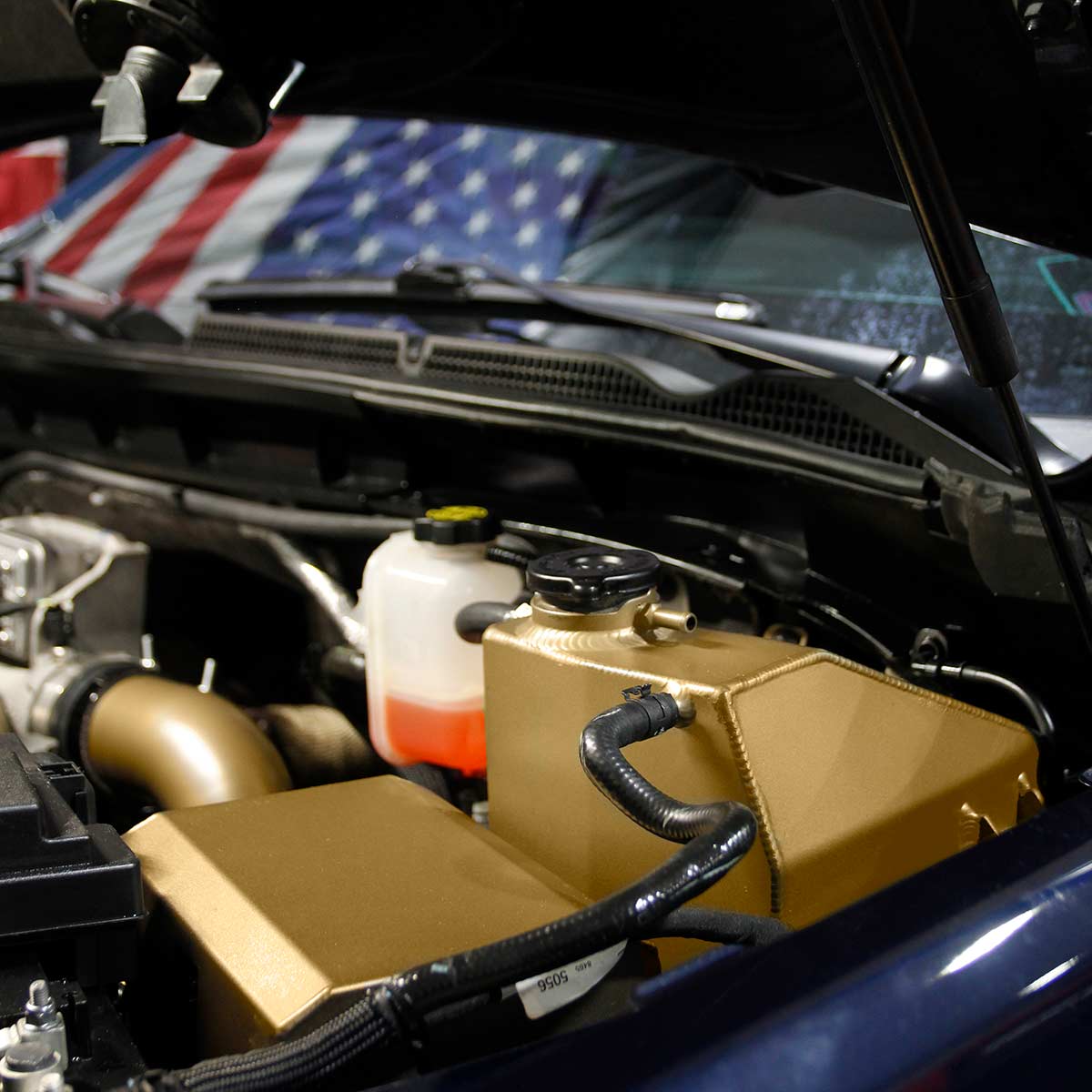 HSP Diesel coolant tank installed in a 2020-2026 L5P Duramax engine bay